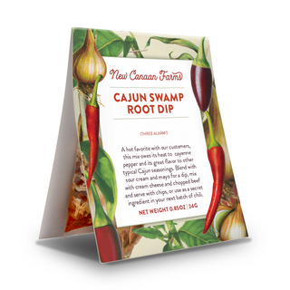 New Canaan Farms Cajun Swamp Root Dip packaging with chili peppers and onions on a white background